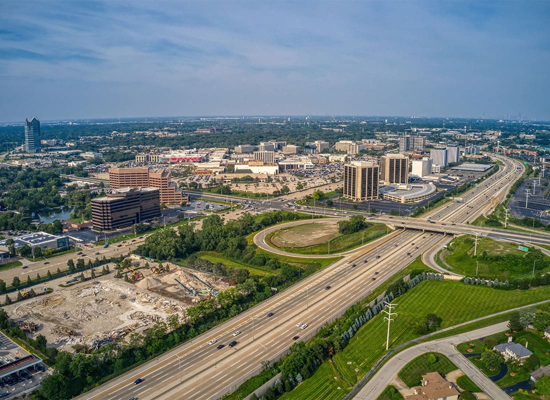 Oakbrook IL - Aerial View of Downtown Oakbrook Over Highway Travel
